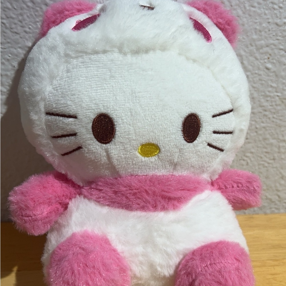 Pink and White Stuffed Animal Plush Toy with Round Body and Minimalist Face